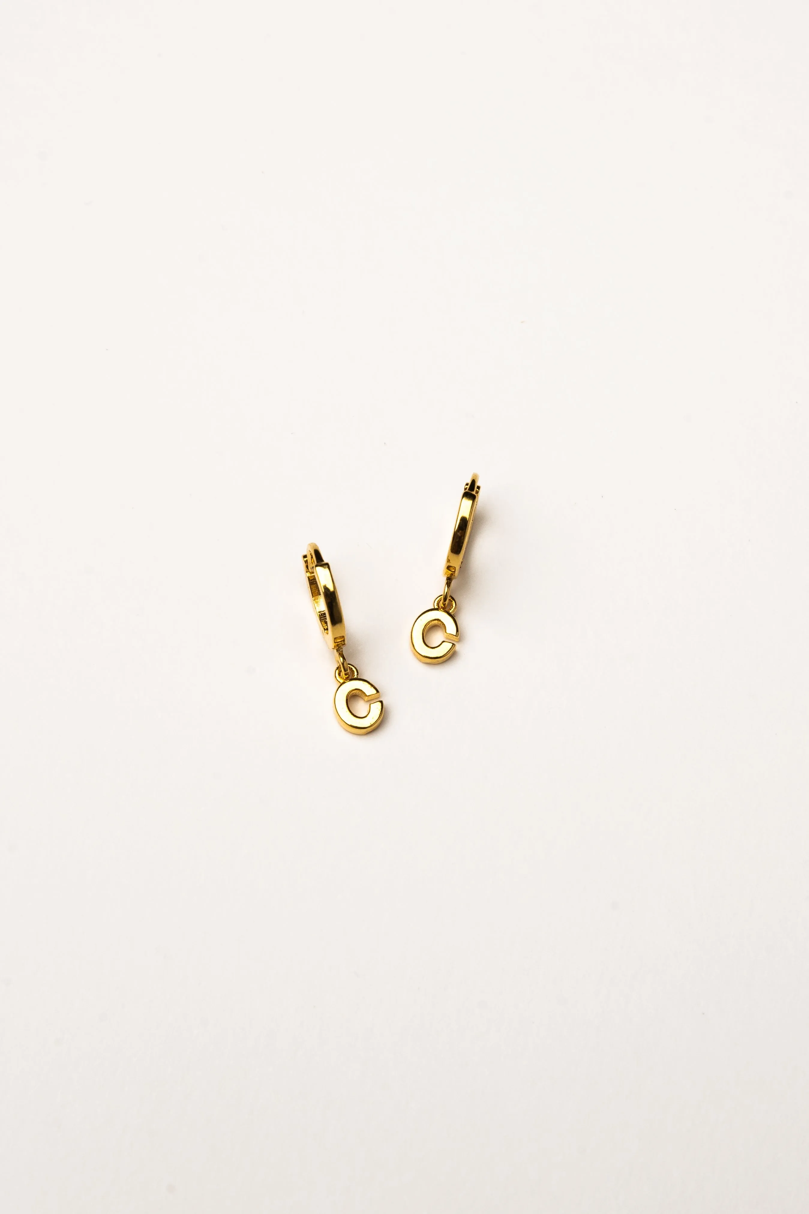 Cove Initial Letter Huggie Earrings