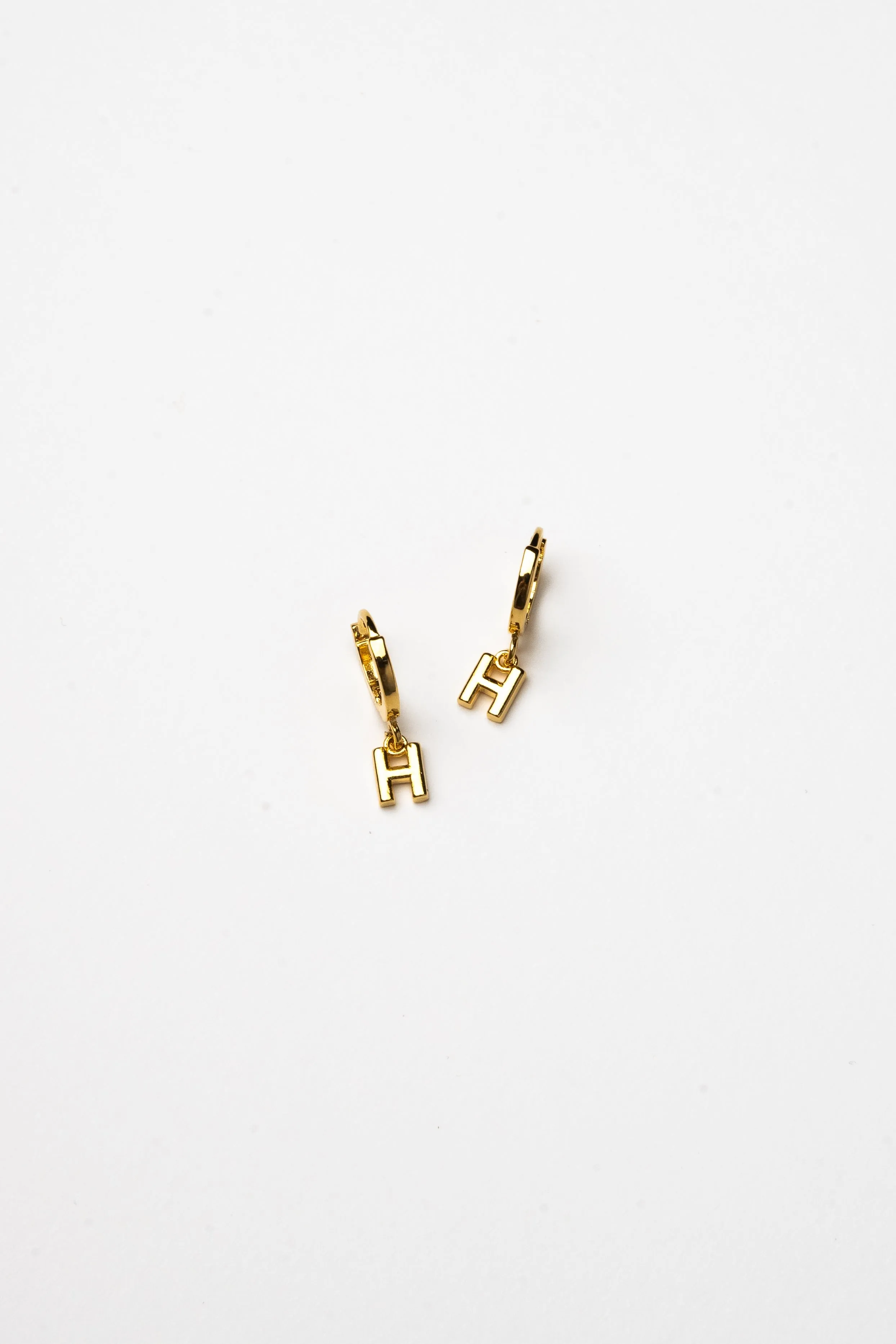 Cove Initial Letter Huggie Earrings