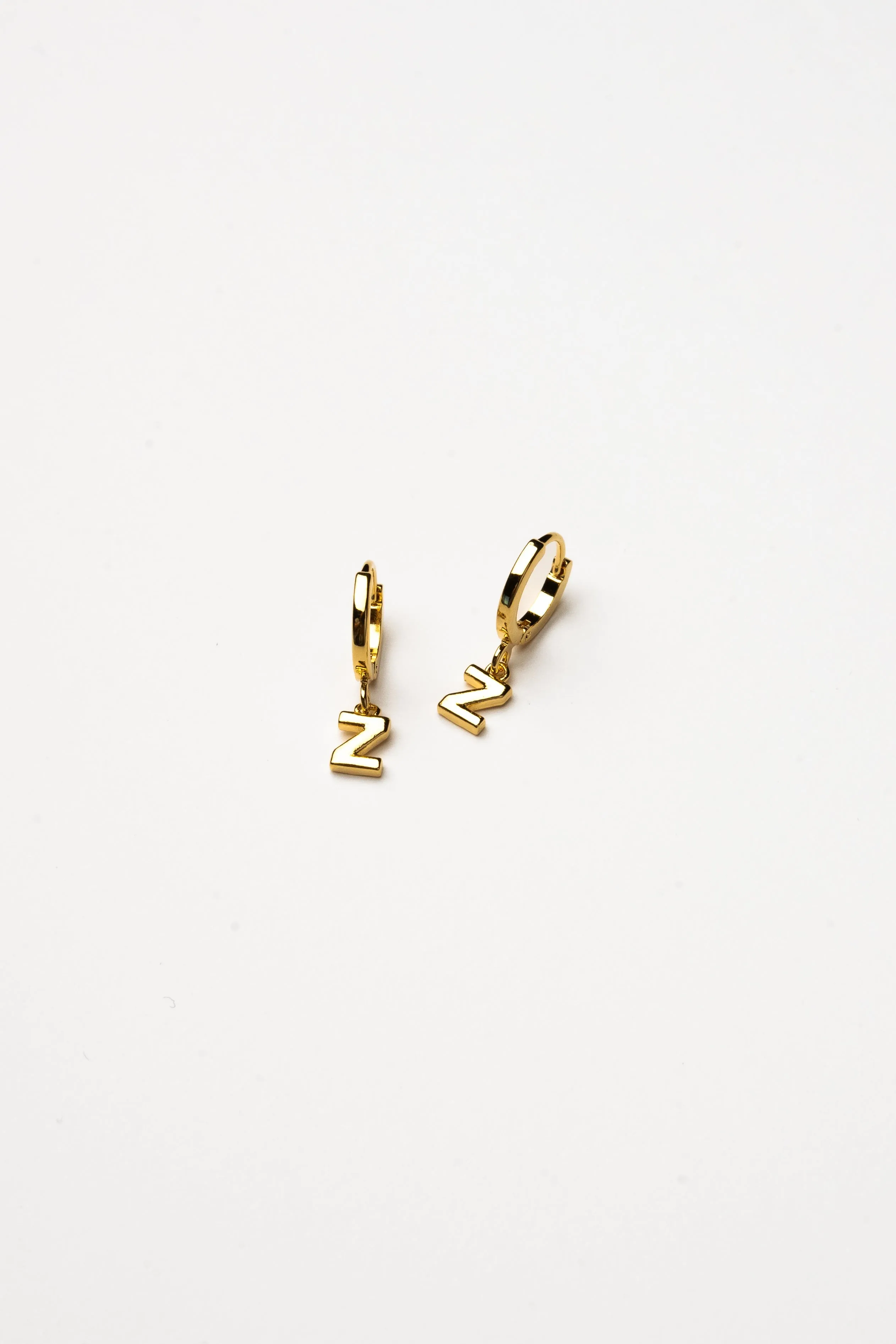 Cove Initial Letter Huggie Earrings