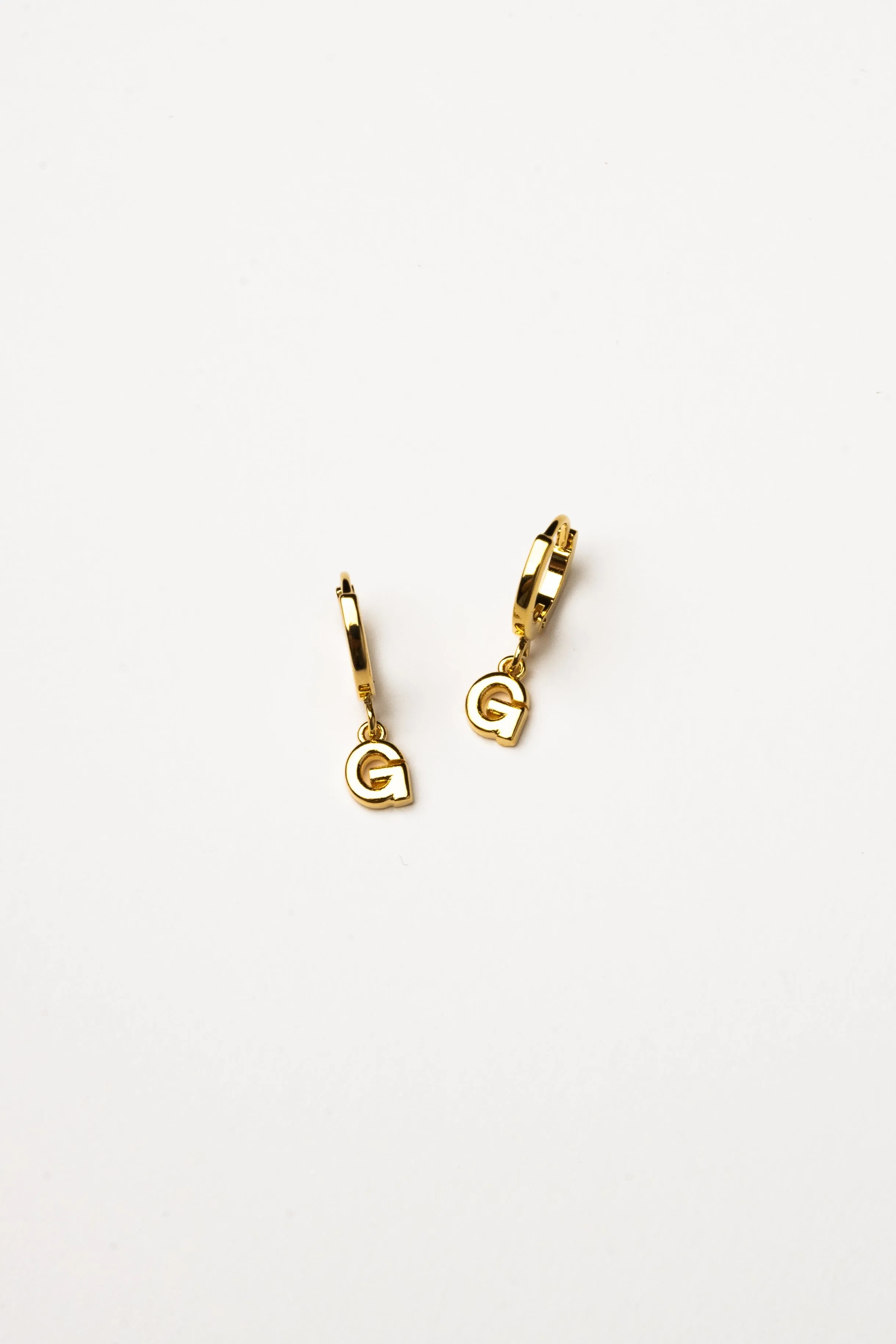 Cove Initial Letter Huggie Earrings