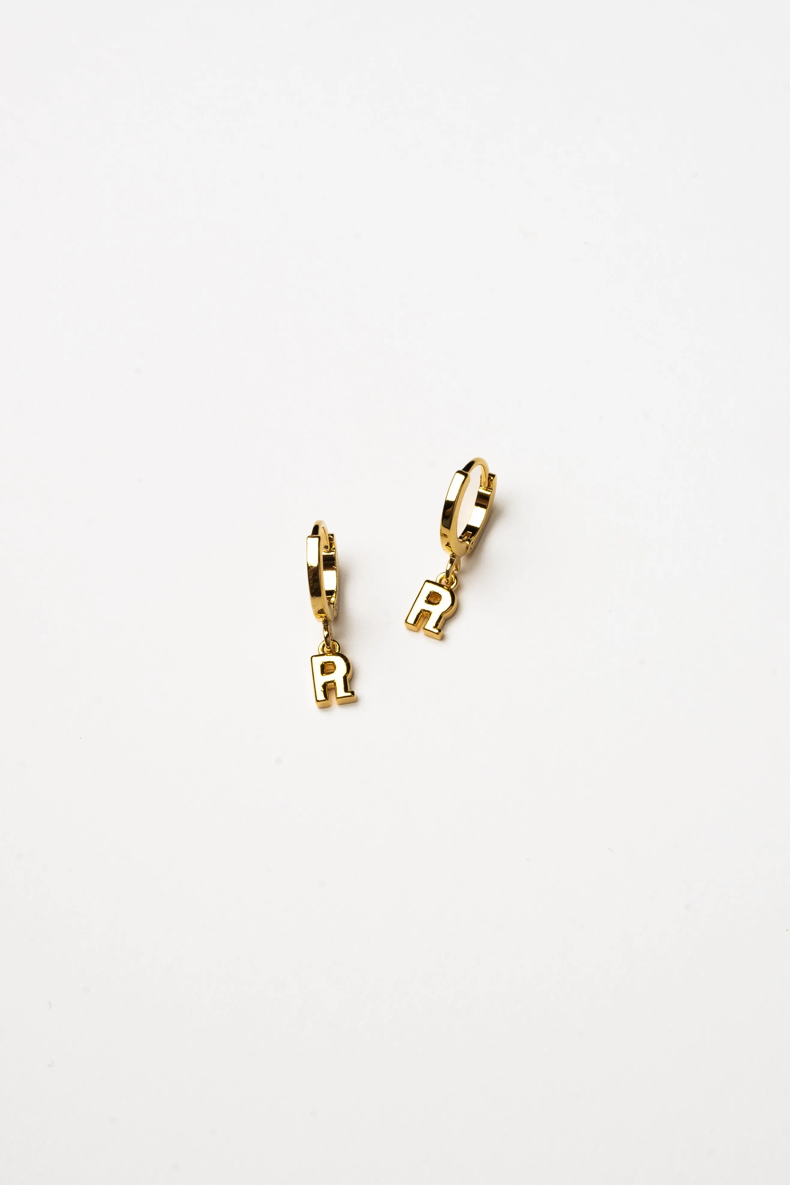 Cove Initial Letter Huggie Earrings